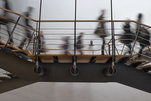 time lapse photography of people passing on bridge